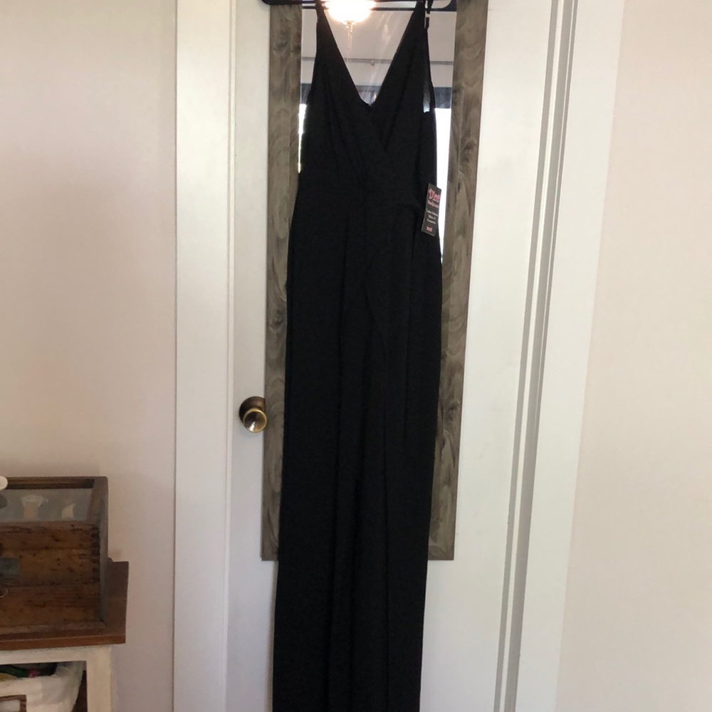 Black pant suit with mid slits on both legs.
